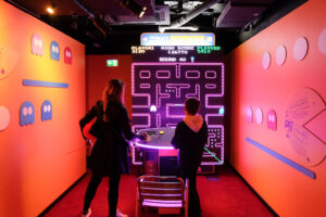 woman and child playing lifesized pacman